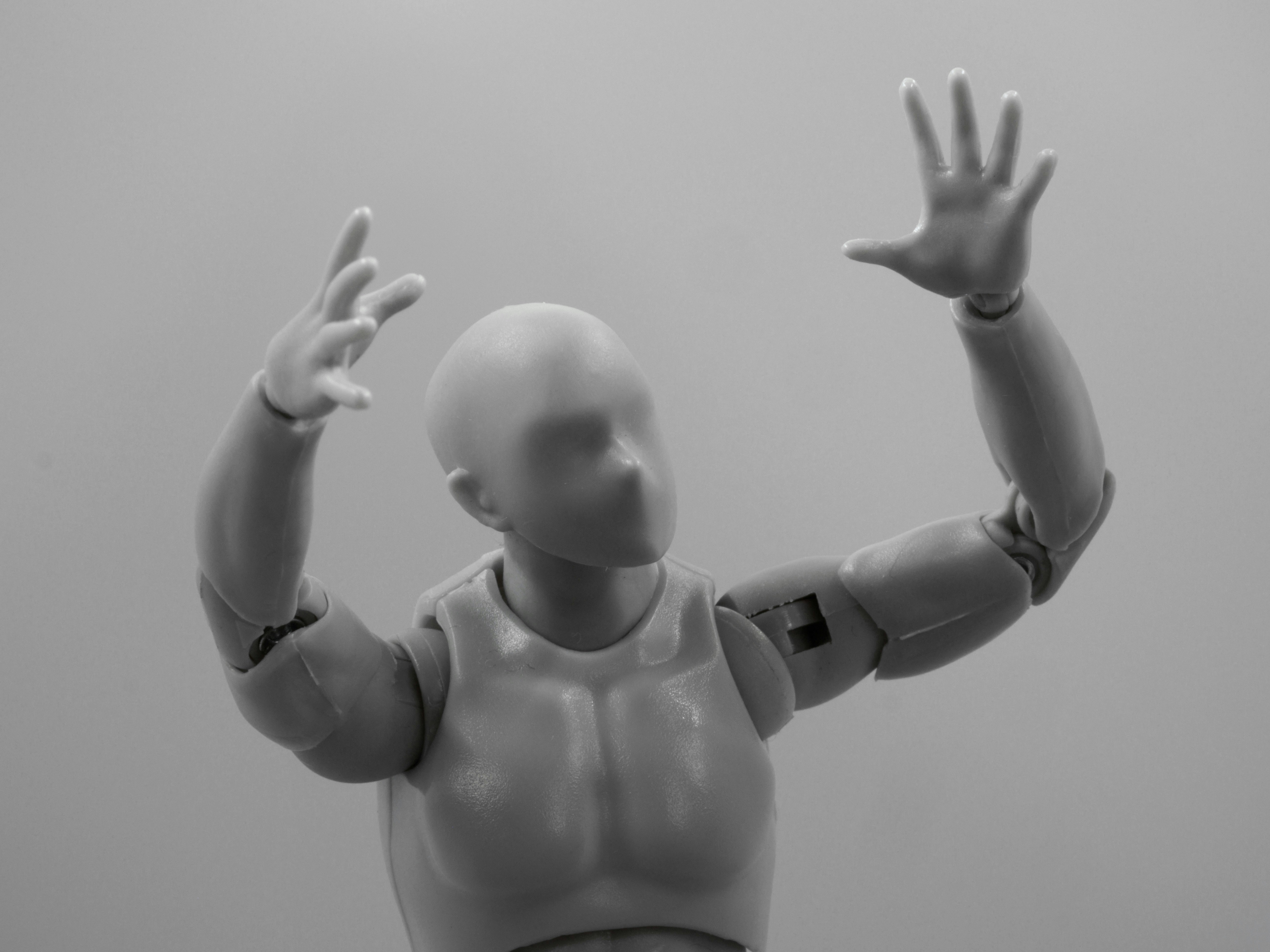Portrait of the blog author, a middle-aged person with a friendly smile, wearing smart casual attire and standing next to an Optimus Gen 2 robot