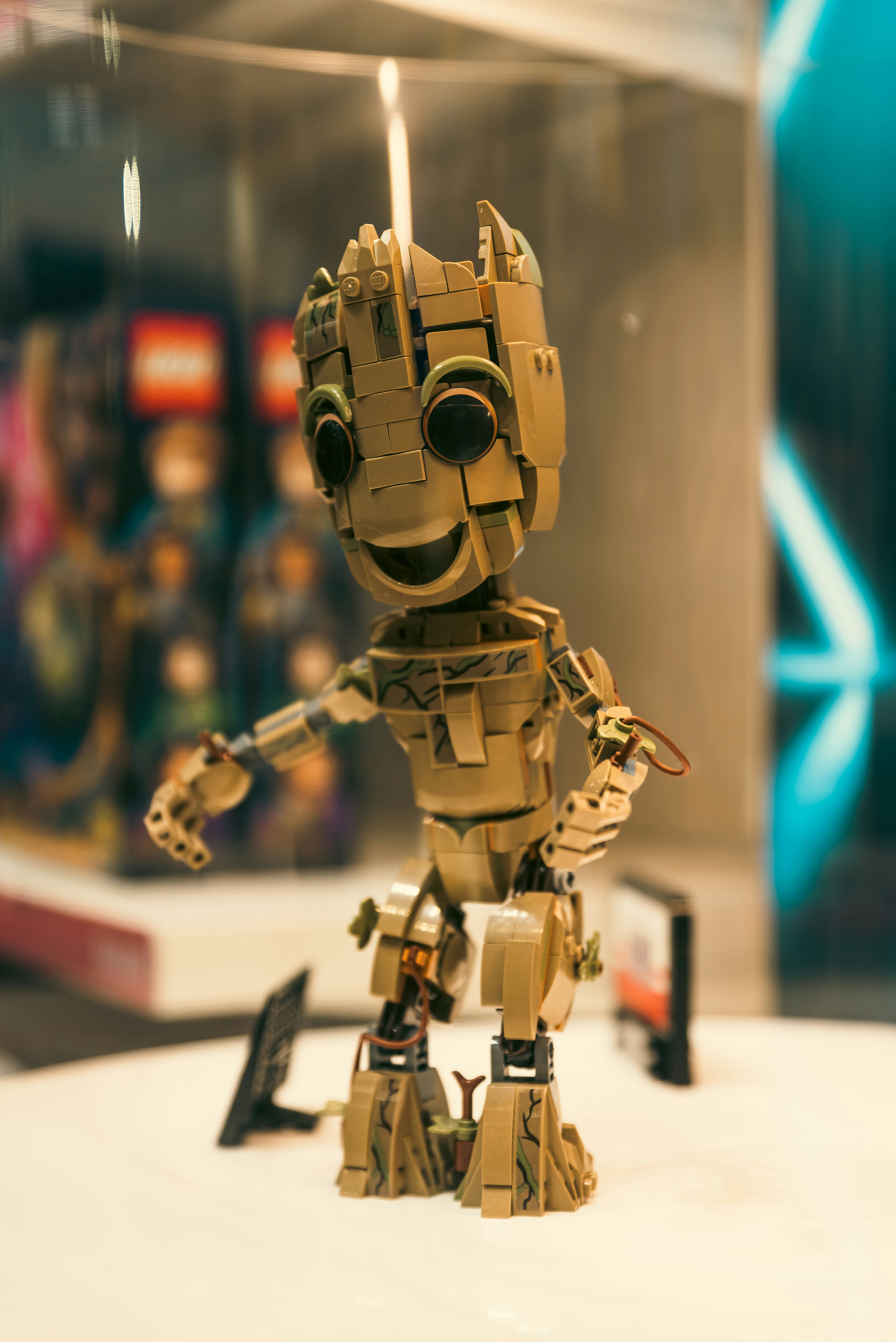 A sleek, humanoid robot Optimus Gen 2 standing in a modern living room, showcasing its advanced design and capabilities