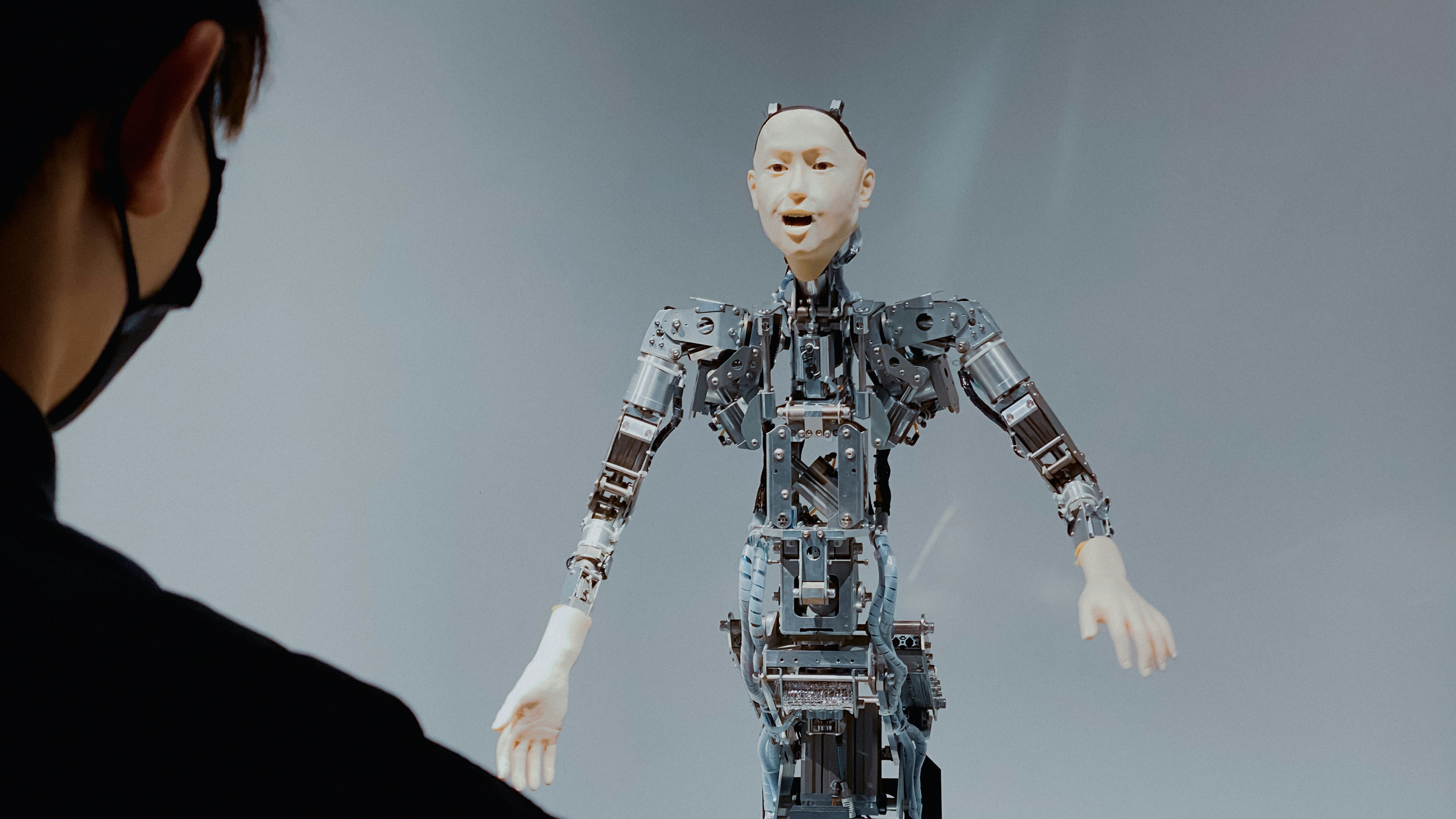 Optimus Gen 2 robot performing various household tasks like cooking, cleaning, and gardening